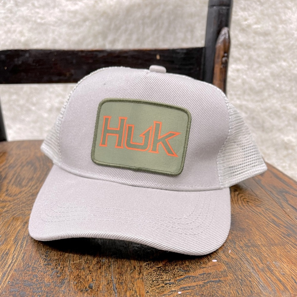 Men’s adjustable Huk hat. NWT still in packaging.